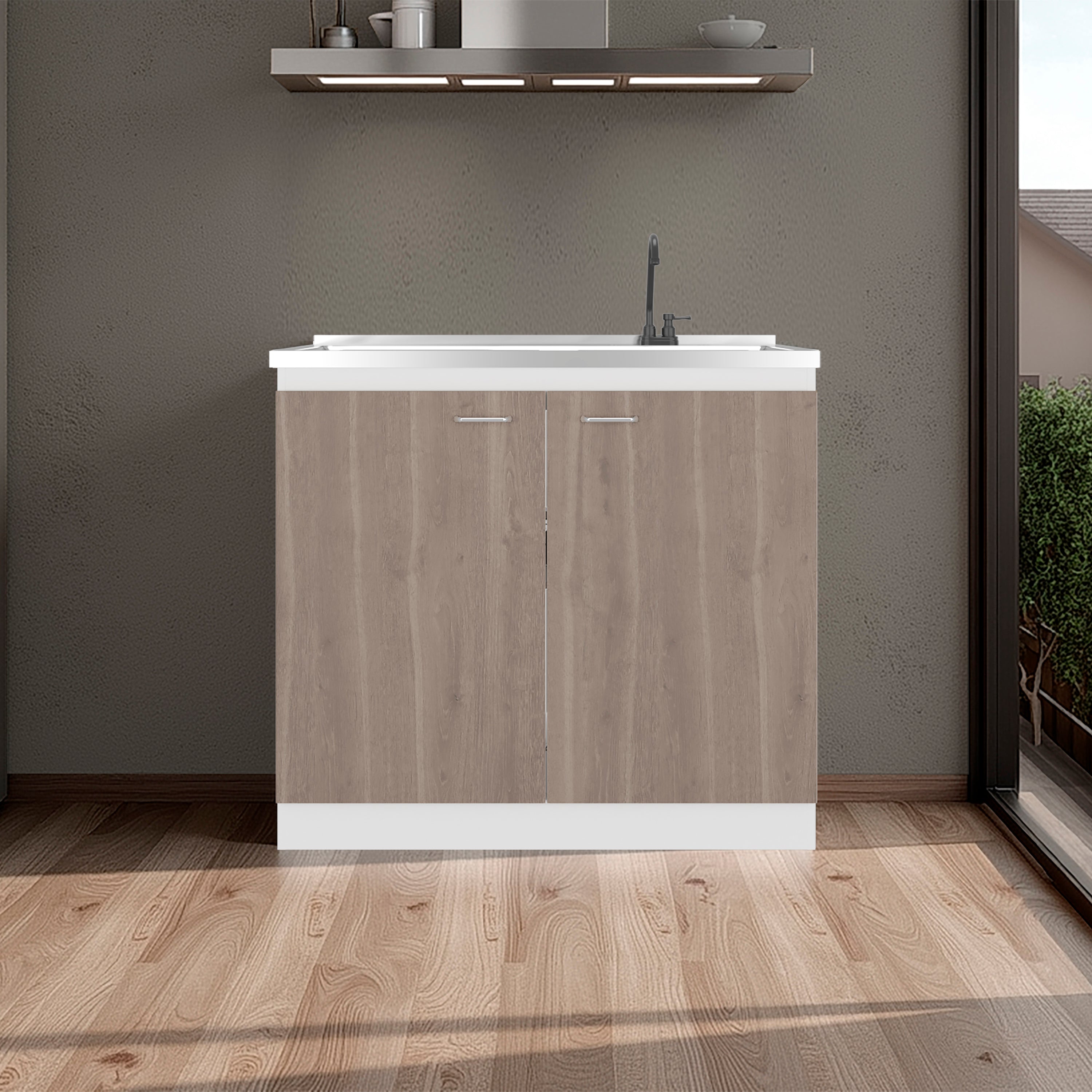Modern kitchen island with wooden finish and white countertop in a room with wooden floor and gray walls.